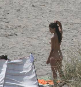 Topless-girl-goes-full-nudist-at-textile-beach-Almeria-%28Spain%29-g6x556dlen.jpg