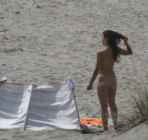 Topless girl goes full-nudist at textile beach  Almeria (Spain) h6x556ekhx