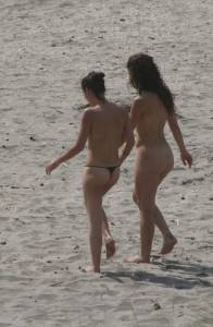 Topless girl goes full-nudist at textile beach  Almeria (Spain) v6x556hmpn