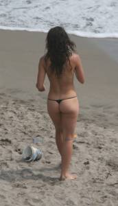 Topless girl goes full-nudist at textile beach  Almeria (Spain)-e6x555gtvo.jpg