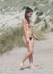 Topless girl goes full-nudist at textile beach  Almeria (Spain)-66x555sryk.jpg