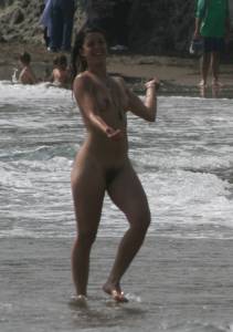 Topless girl goes full-nudist at textile beach  Almeria (Spain) p6x556my0i